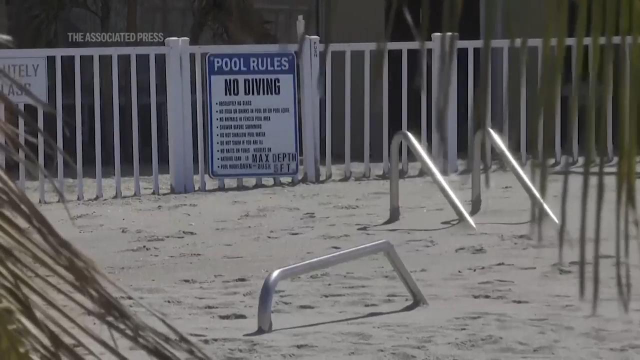 Florida digs out of mountains of sand swept in by backtoback